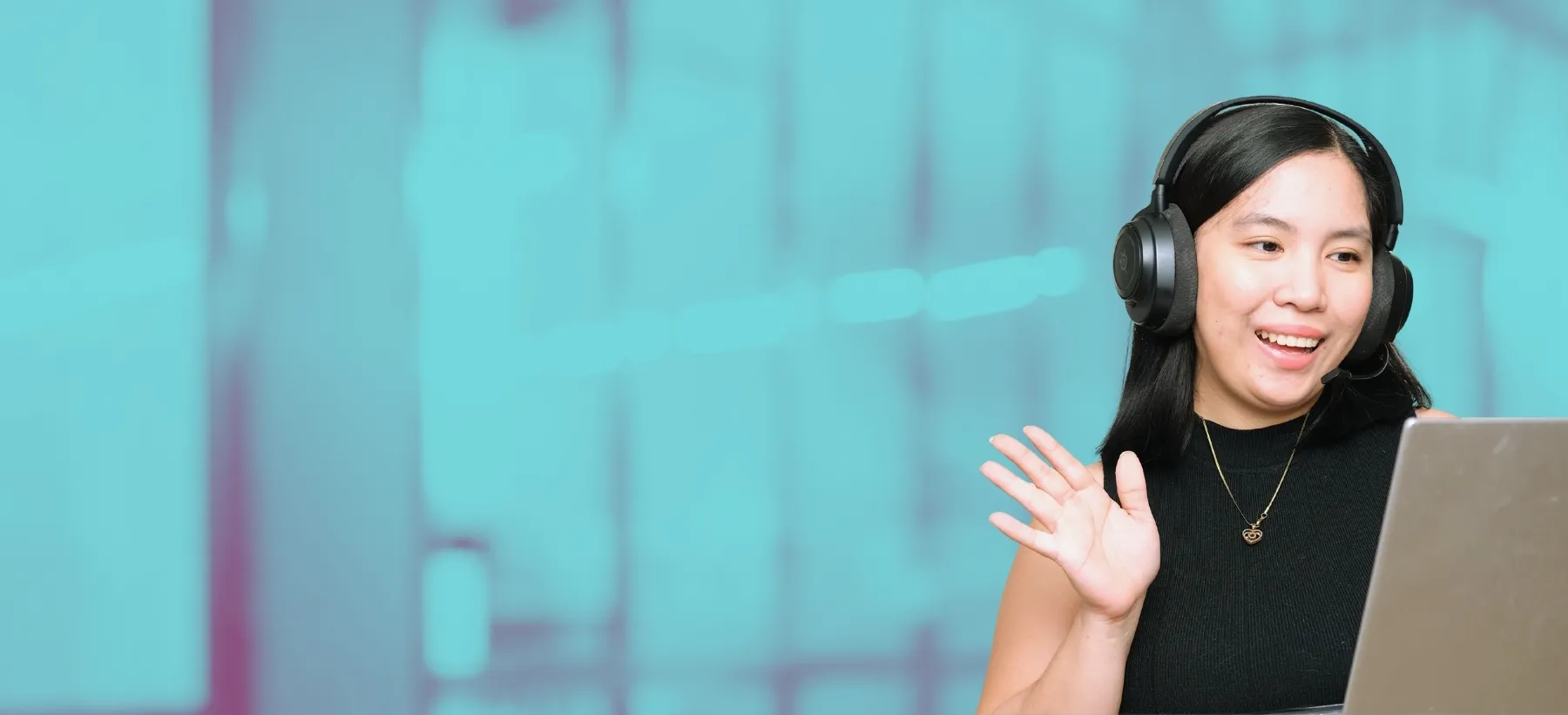 HelpSquad patient support agent in a headset waving during a video call
