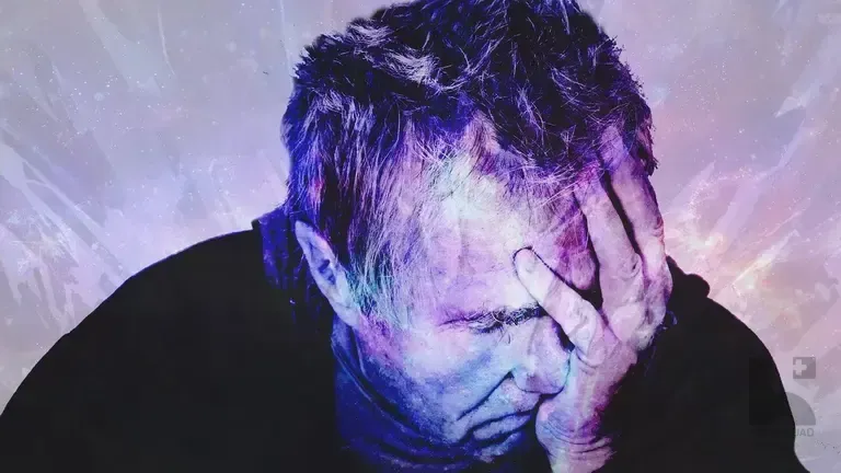 Distressed man holding his forehead with one hand against a purple cosmic textured background